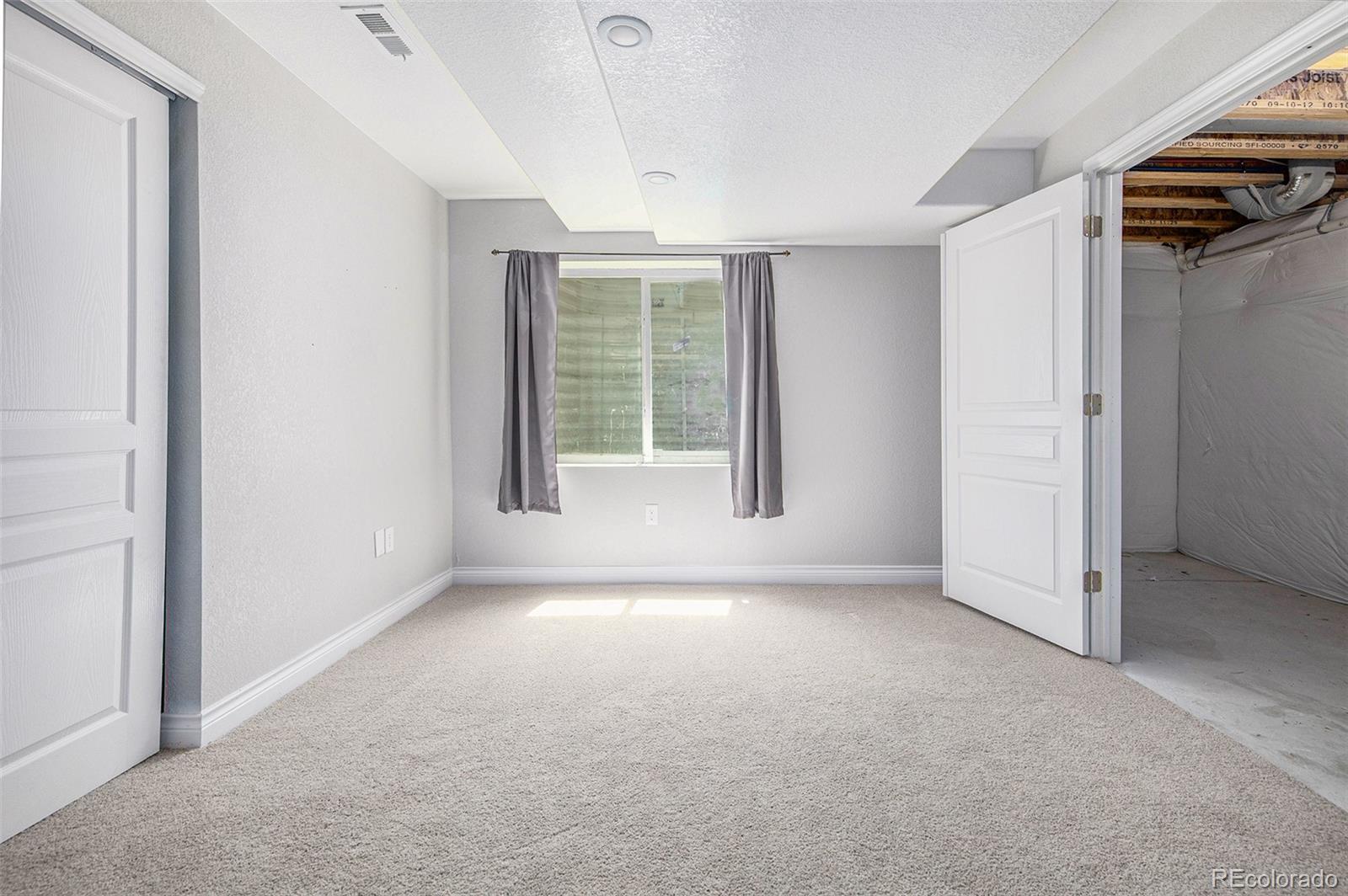 3751 West 136th Avenue, Unit C3 Broomfield, CO 80023 - Photo 17 of 20 an empty room with windows