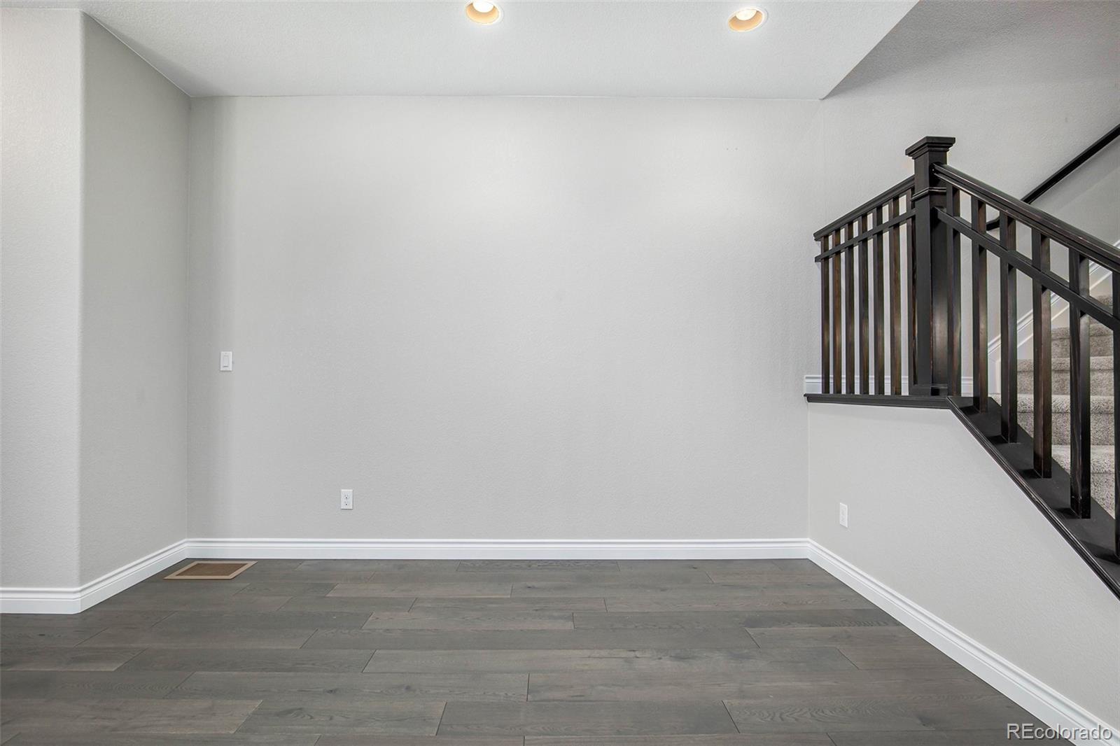 3751 West 136th Avenue, Unit C3 Broomfield, CO 80023 - Photo 9 of 20 a view of a hallway with wooden floor