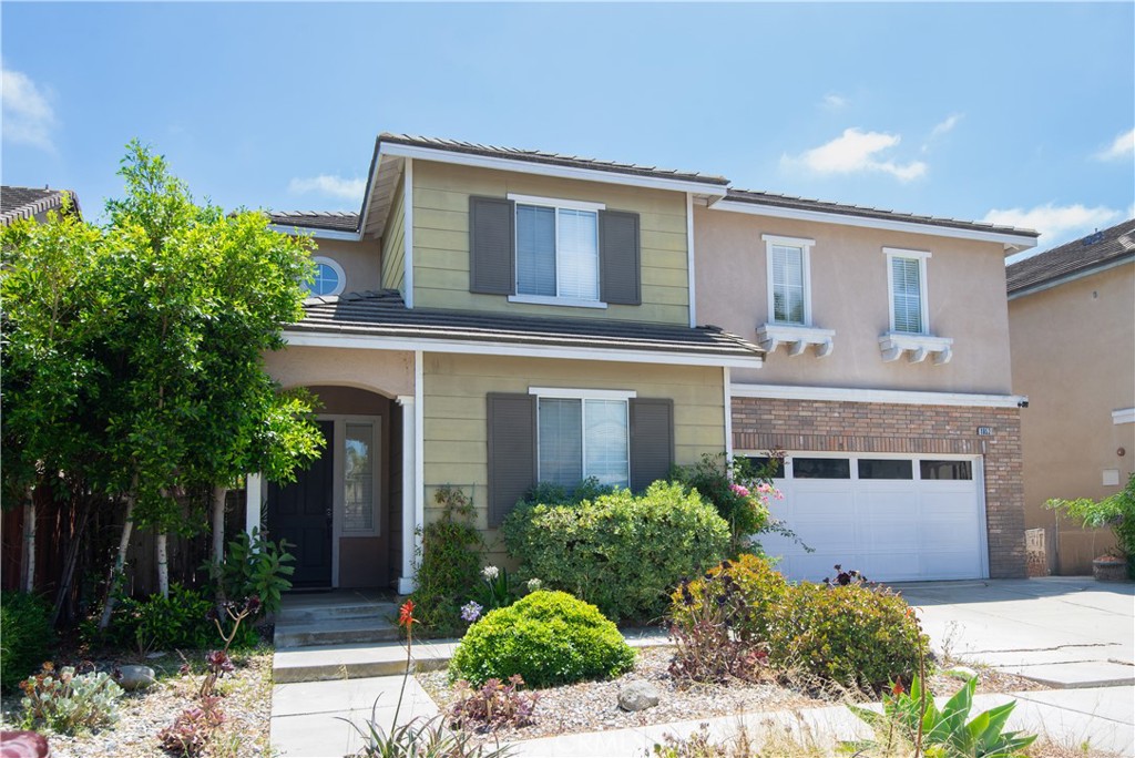 1652 Tiesa Lane Oxnard, CA 93030 - Photo 3 of 9 a front view of a house with garden