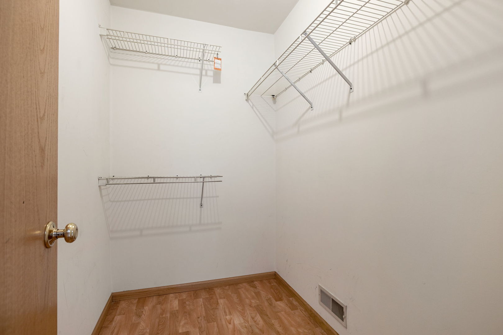 18112 Rita Road, Unit 3C Tinley Park, IL 60477 - Photo 12 of 18 a view of a room with racks on the wall