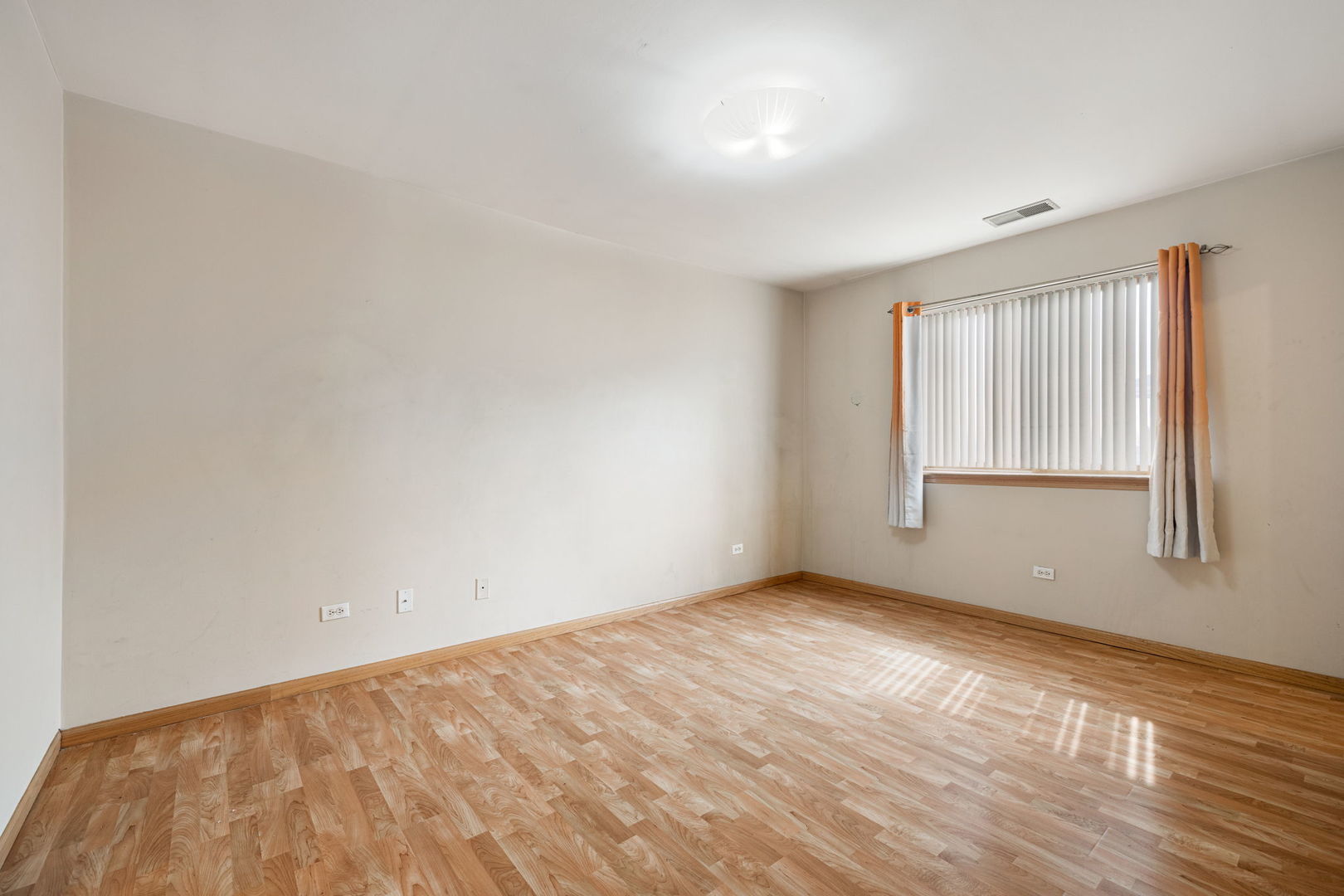 18112 Rita Road, Unit 3C Tinley Park, IL 60477 - Photo 14 of 18 wooden floor in an empty room with a window
