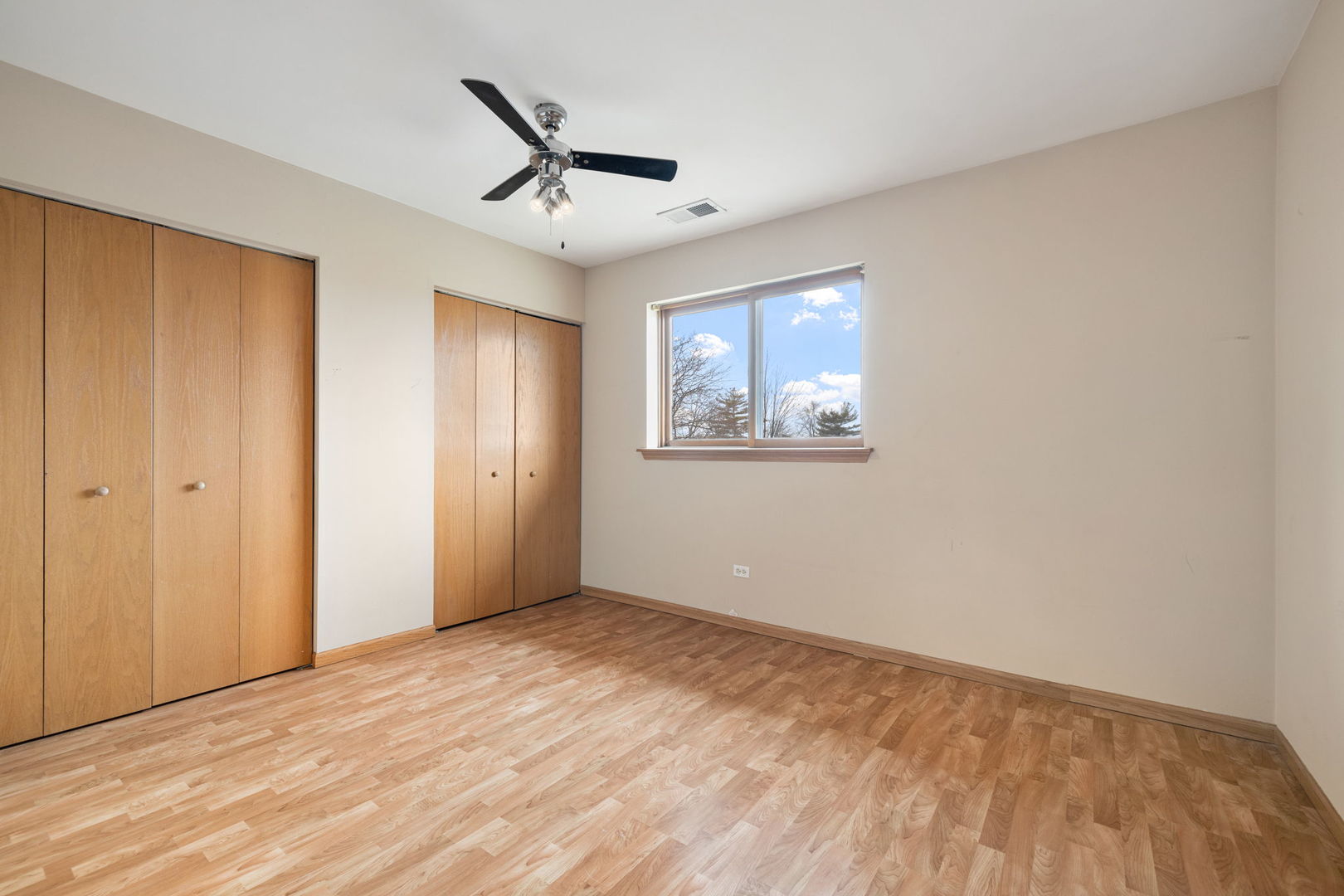 18112 Rita Road, Unit 3C Tinley Park, IL 60477 - Photo 16 of 18 a view of empty room with wooden floor and ceiling fan