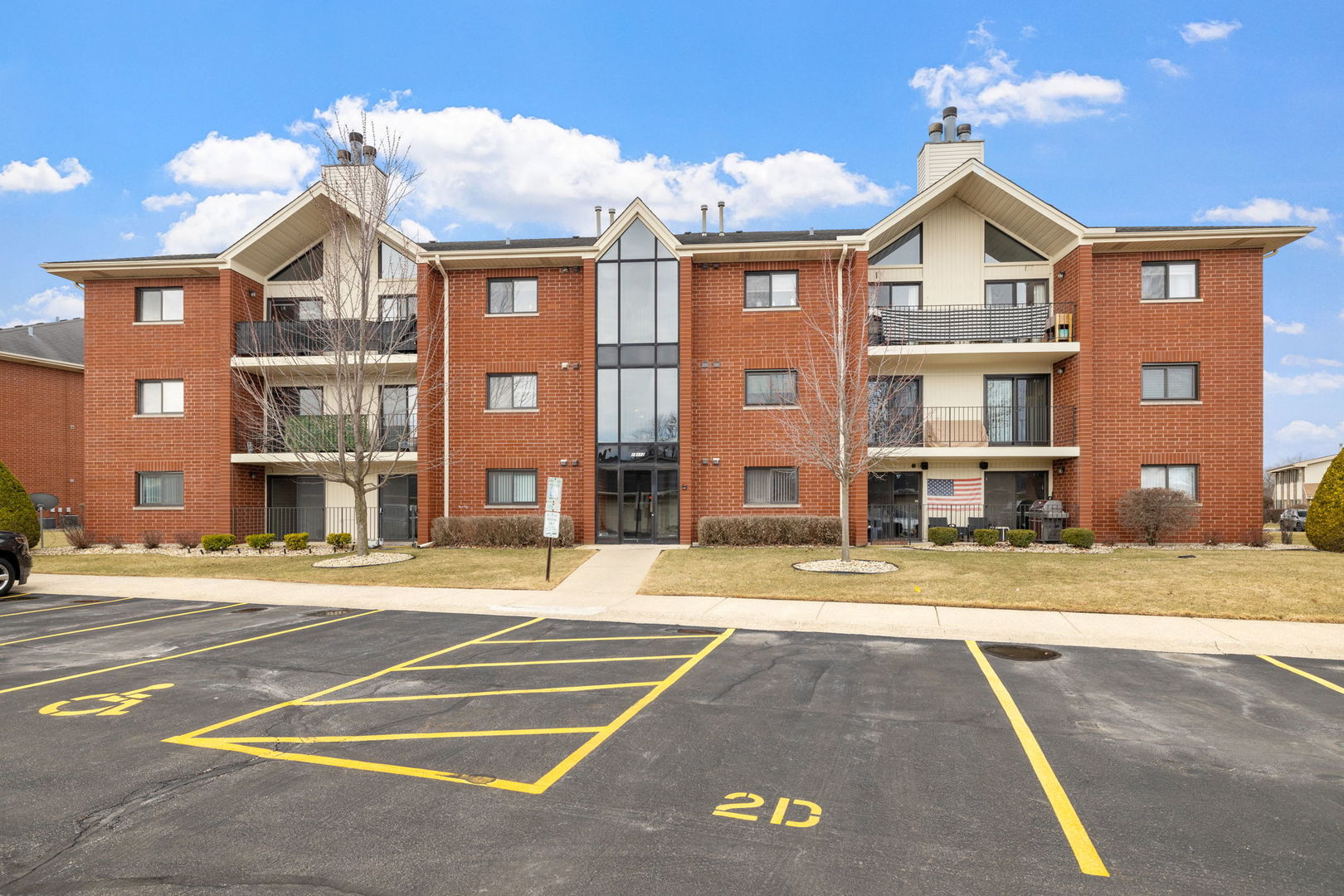 18112 Rita Road, Unit 3C Tinley Park, IL 60477 - Photo 18 of 18 a view of a big building with a street