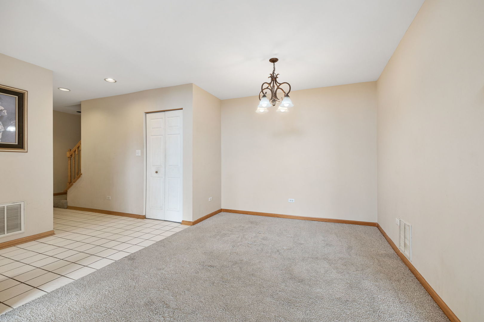 18112 Rita Road, Unit 3C Tinley Park, IL 60477 - Photo 5 of 18 a view of a room with a chandelier fan and wooden floor