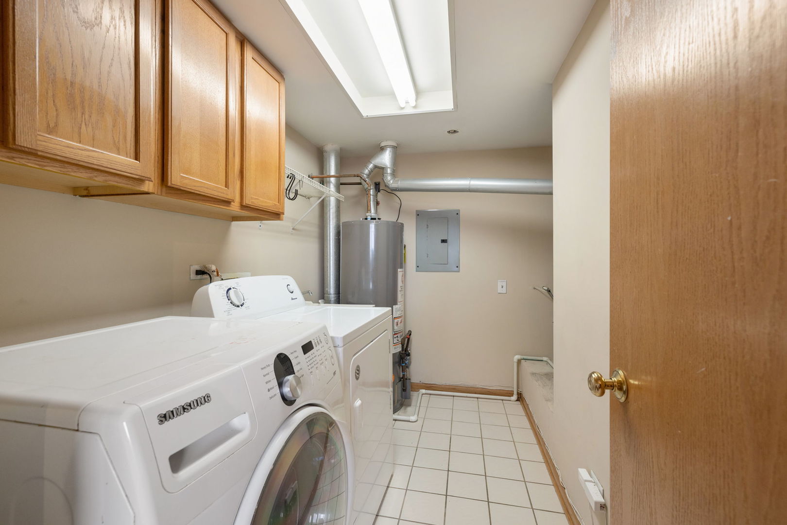 18112 Rita Road, Unit 3C Tinley Park, IL 60477 - Photo 8 of 18 a utility room with dryer and washer