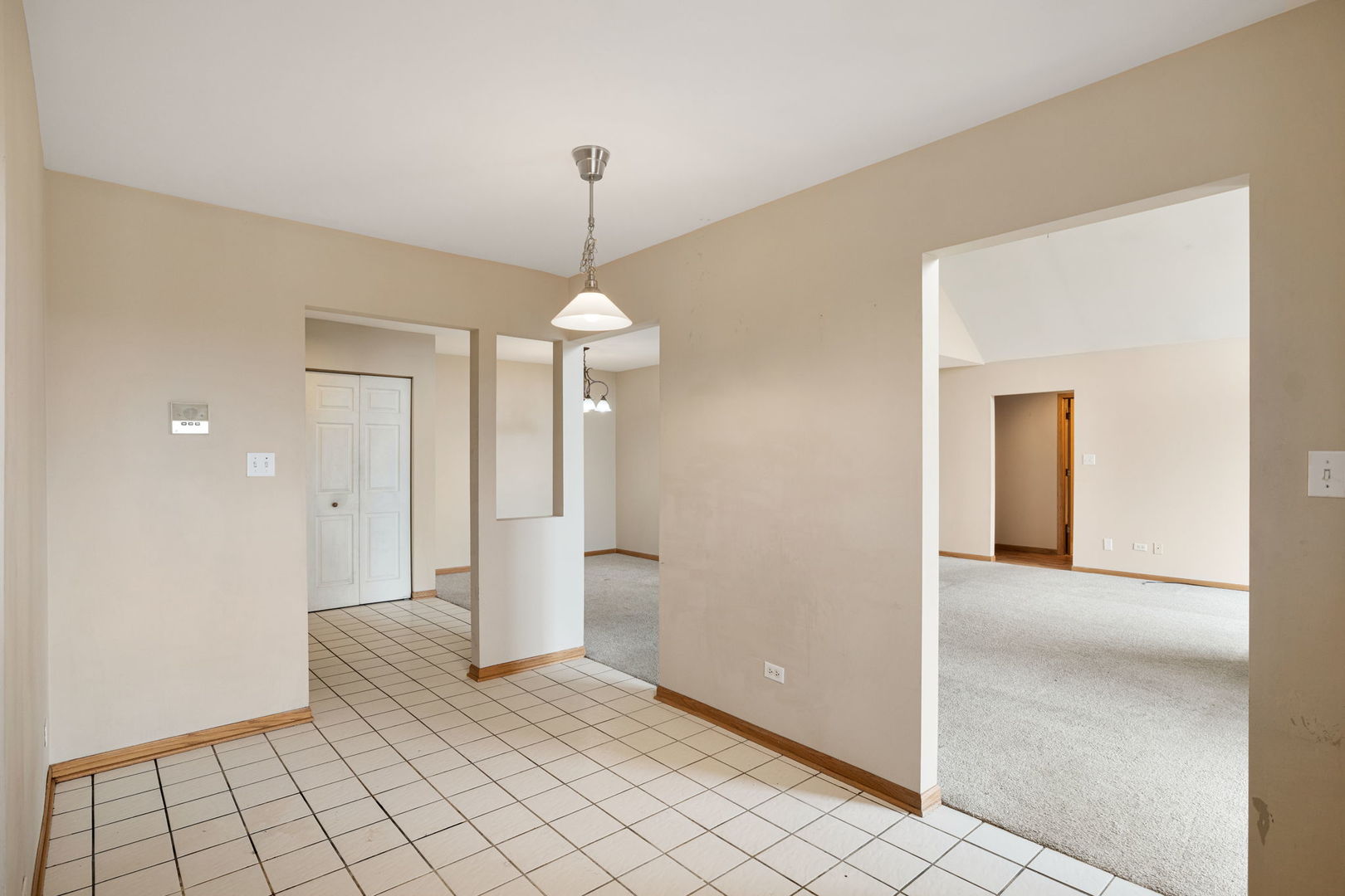 18112 Rita Road, Unit 3C Tinley Park, IL 60477 - Photo 9 of 18 a view of an empty room and window