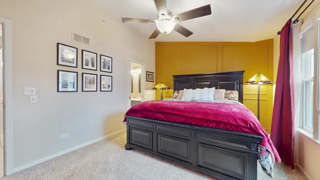 a bed room with a bed and a chandelier