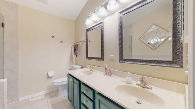 a bathroom with a sink vanity and a mirror
