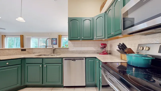 a kitchen with a sink and cabinets