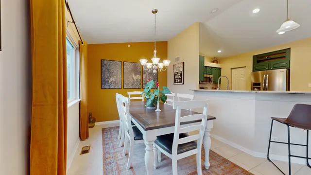 a dining room with furniture and window