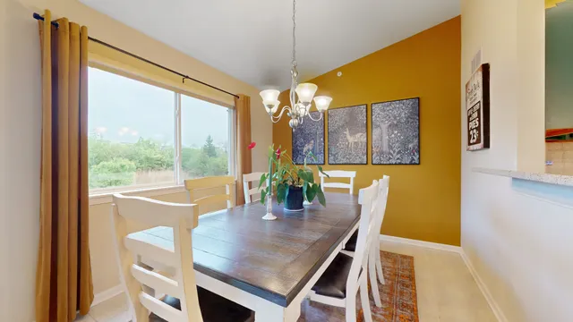 a view of a dining room with furniture window and outside view