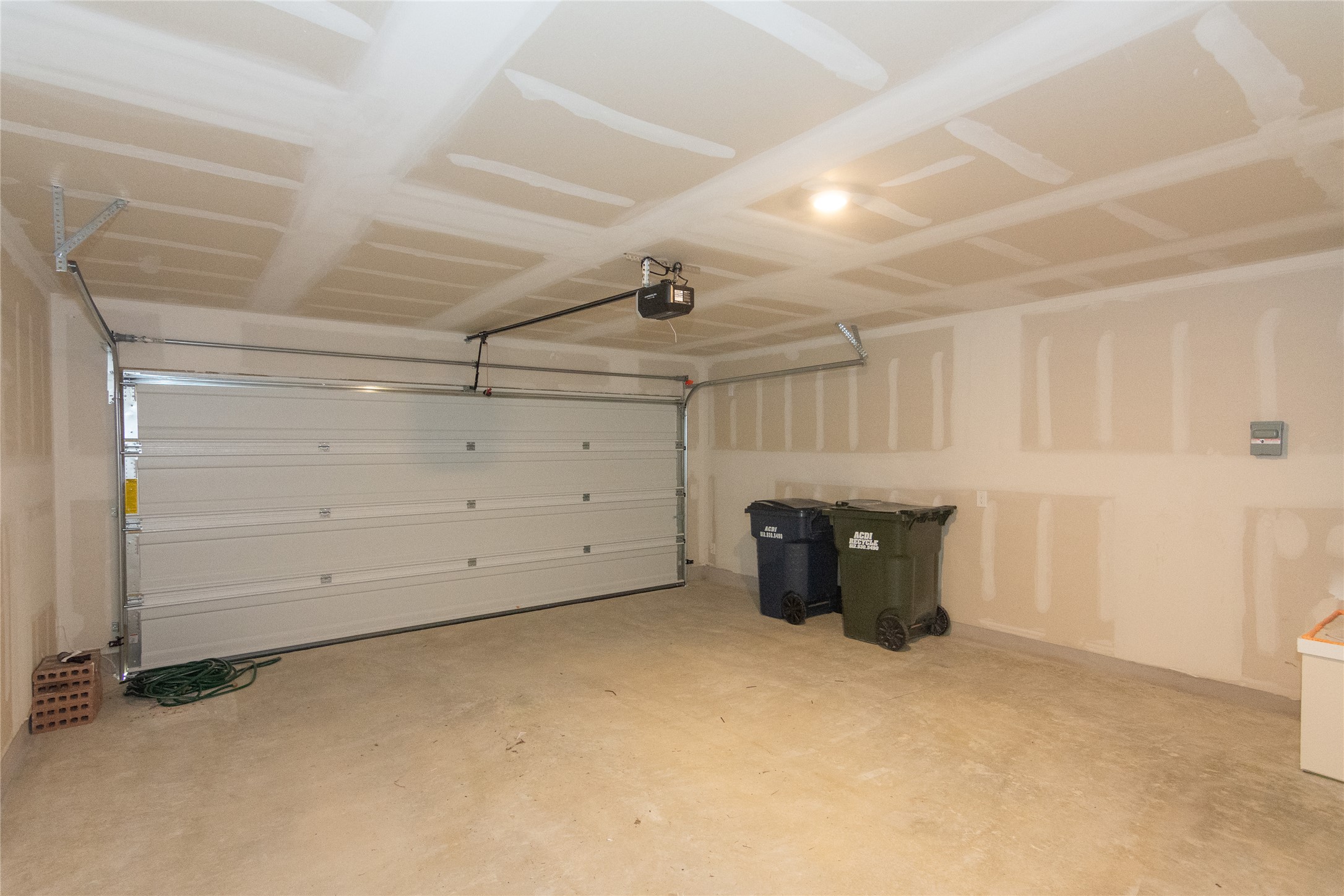 153 Star Packer Lane Jarrell, TX 76537 - Photo 22 of 30 A spacious, clean garage provides secure parking and ample storage.