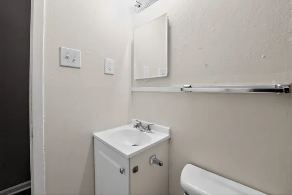 a bathroom with a sink and mirror