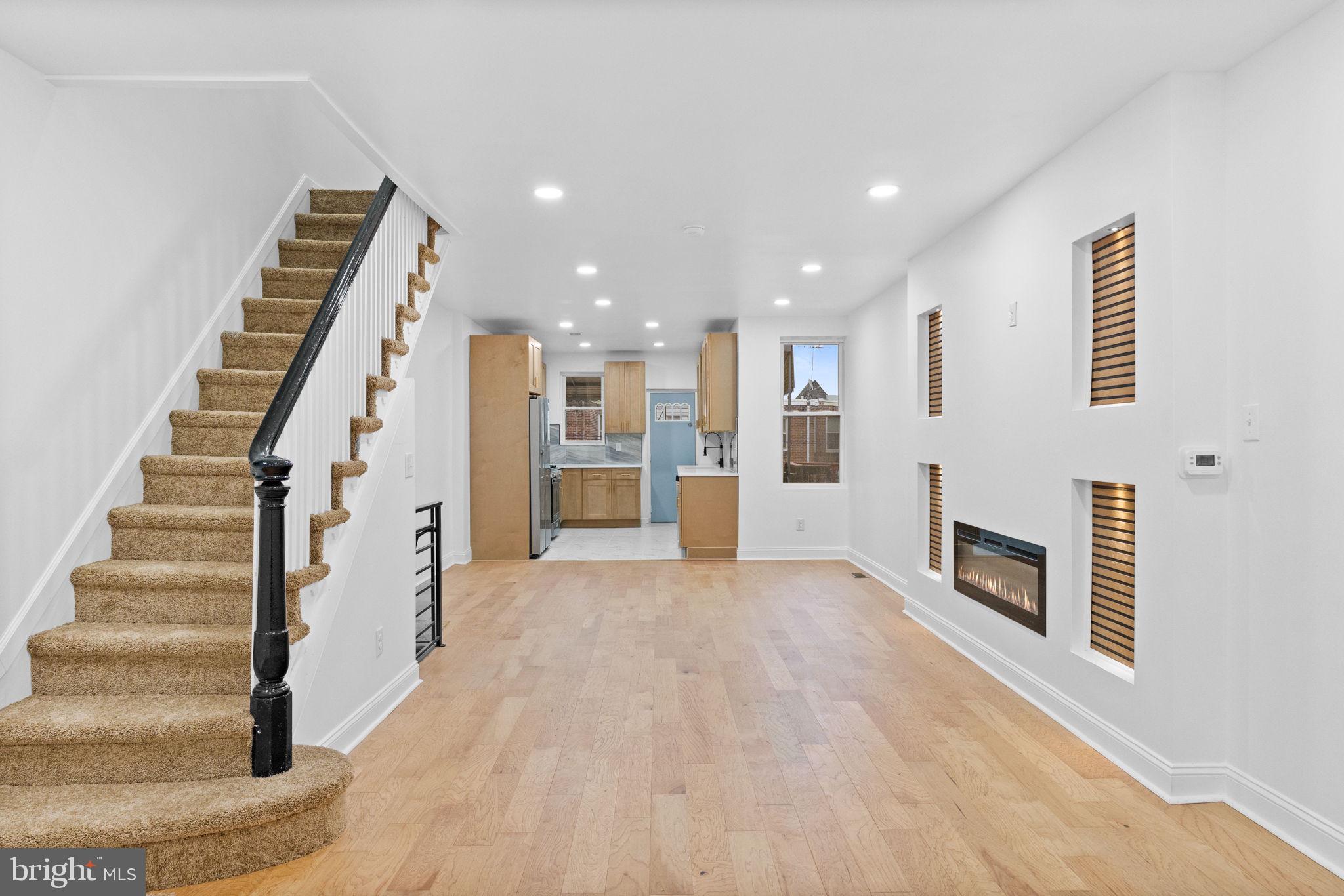7331 East Walnut Lane Philadelphia, PA 19138 - Photo 1 of 49 a view of a livingroom with an empty space and fireplace