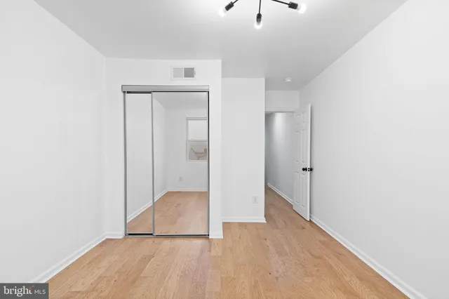 a view of a room with a ceiling fan