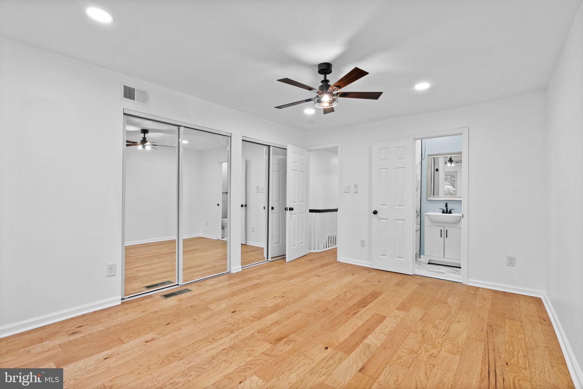 7331 East Walnut Lane Philadelphia, PA 19138 - Photo 33 of 49 a view of empty room with wooden floor and ceiling fan