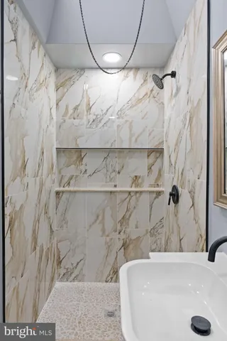 a bathroom with a sink toilet and mirror