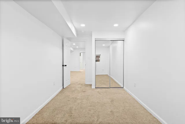 a view of an empty room with stairs