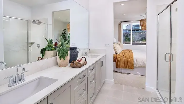 a bathroom with a tub sink and mirror