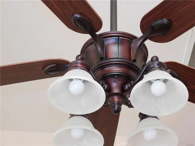 a view of staircase with railing and a chandelier