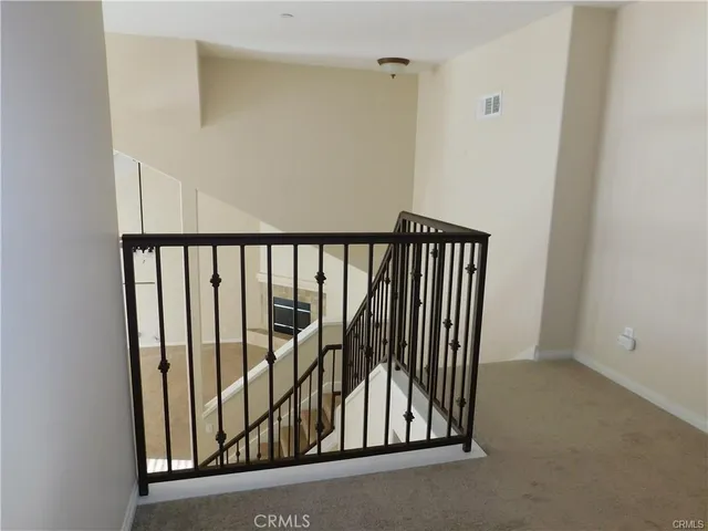 a view of a livingroom with wooden floor and closet area