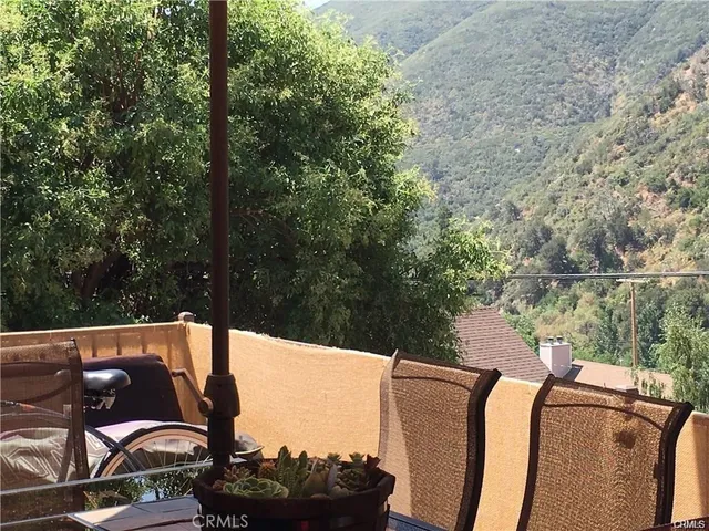 a view of balcony with furniture