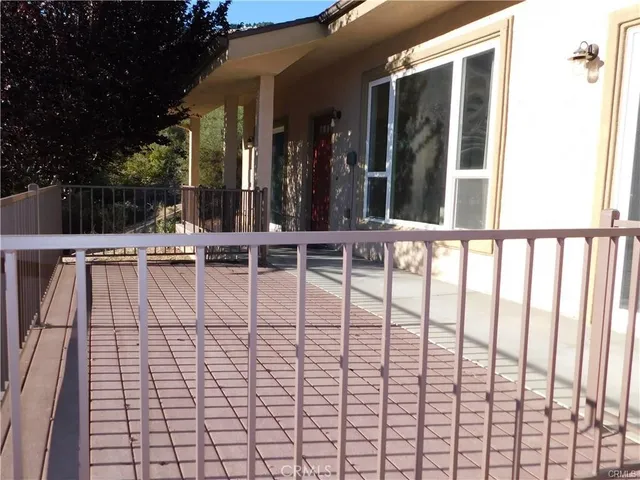 a kitchen with a sink a refrigerator and cabinets