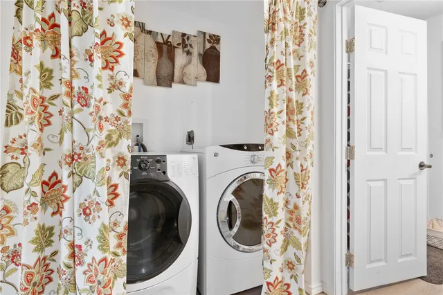 a utility room with dryer and washer