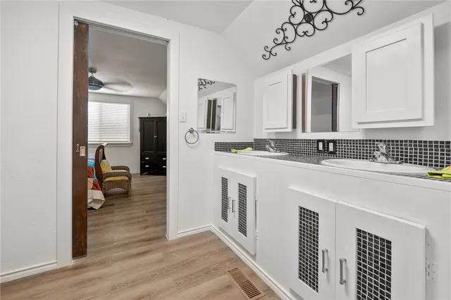 a bathroom with a sink and a mirror