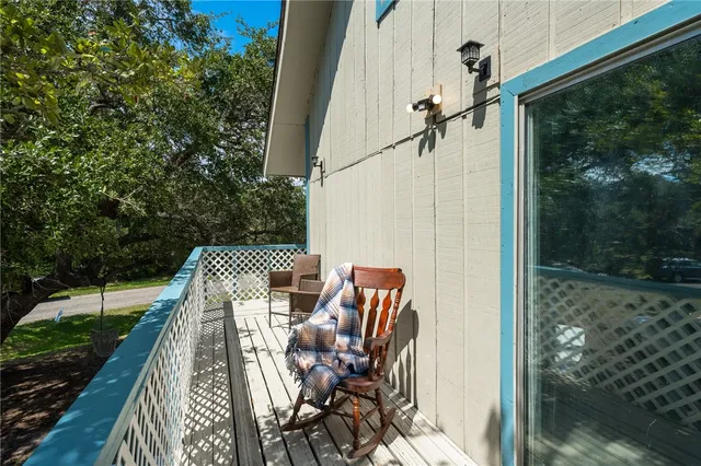 a view of balcony with furniture