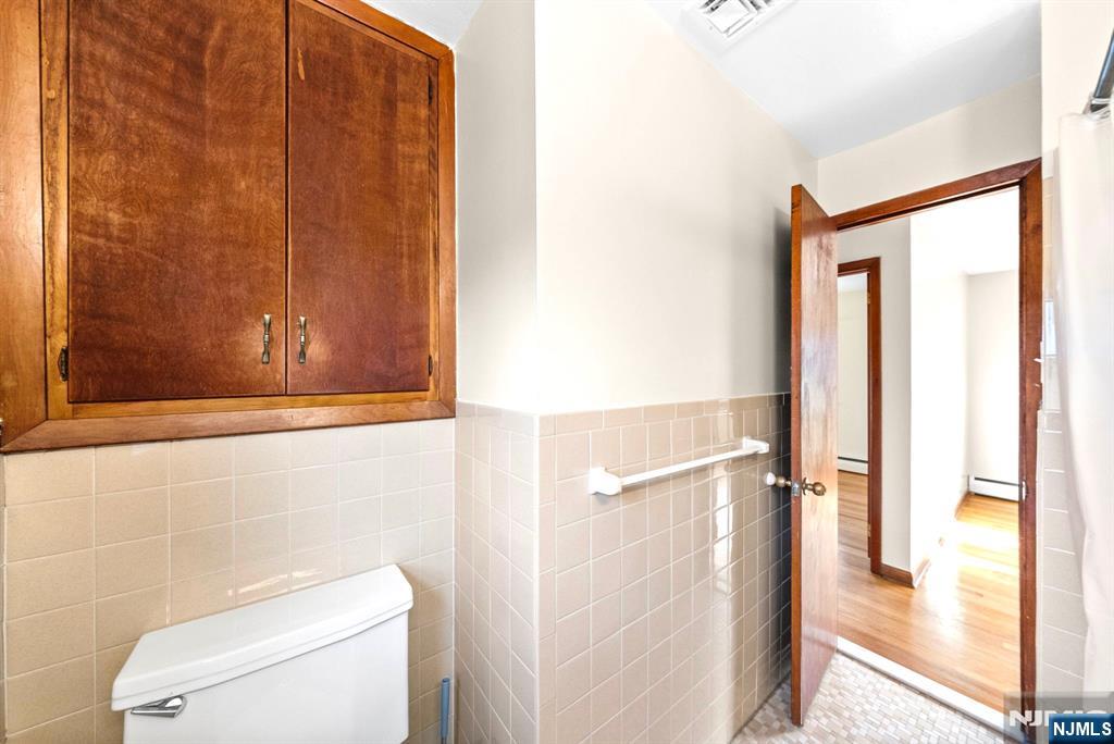 468 Broughton Avenue Bloomfield, NJ 07003 - Photo 14 of 15 a bathroom with a toilet and a shower
