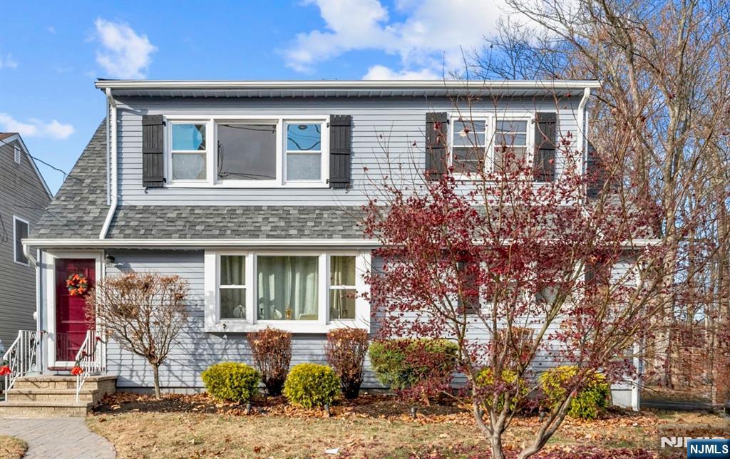 468 Broughton Avenue Bloomfield, NJ 07003 - Photo 15 of 15 a front view of a house with garden