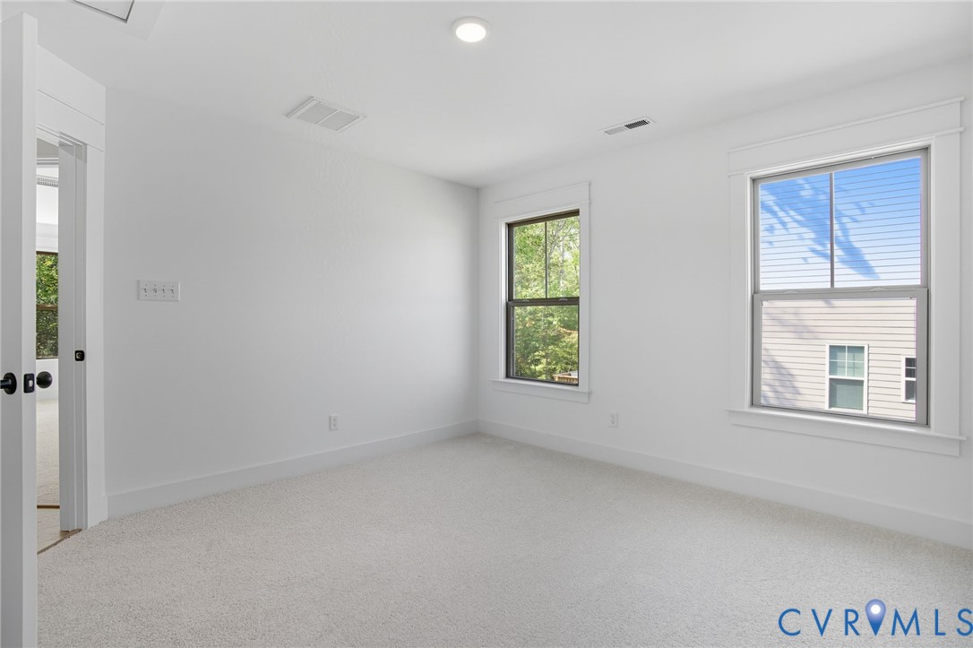 3731 Tuckmar Ridge Drive Moseley, VA 23120 - Photo 11 of 27 an empty room with a window
