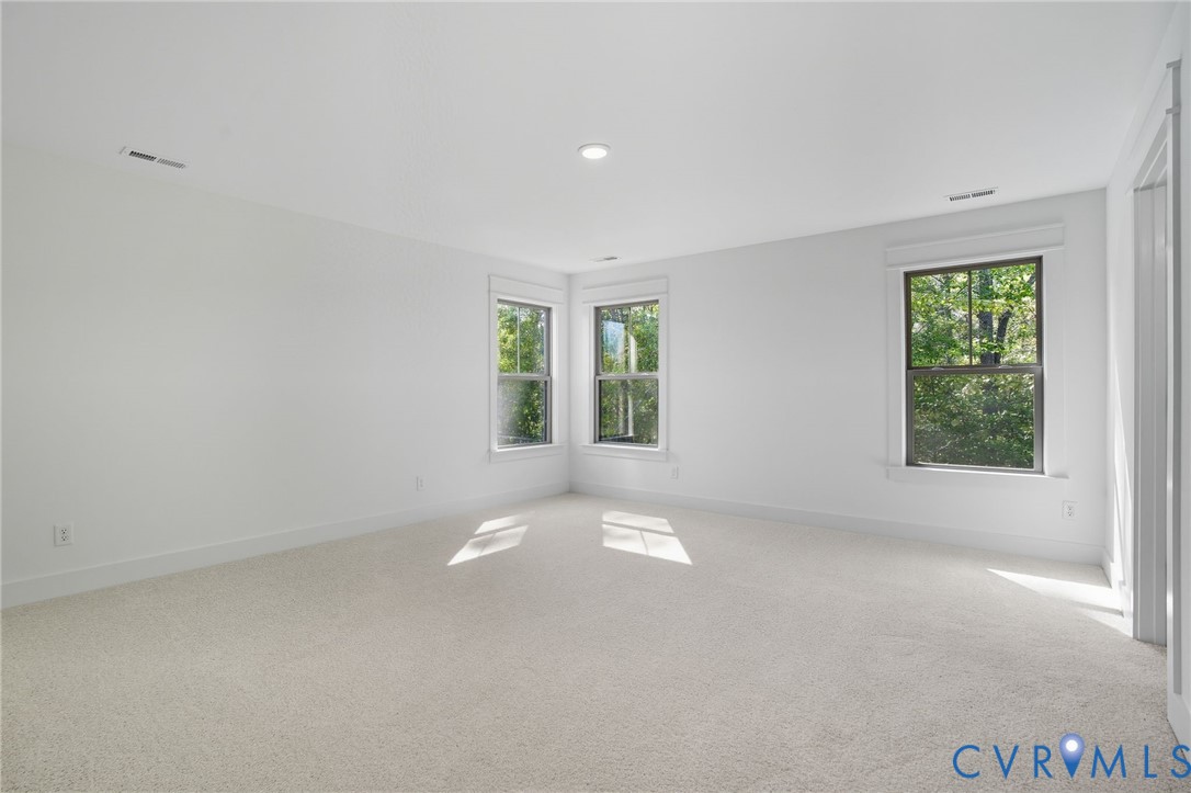 3731 Tuckmar Ridge Drive Moseley, VA 23120 - Photo 16 of 27 an empty room with windows