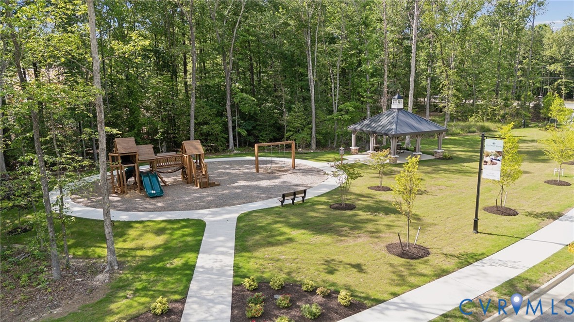 3731 Tuckmar Ridge Drive Moseley, VA 23120 - Photo 23 of 27 a view of a swimming pool with a patio
