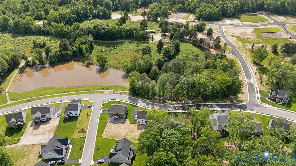 3731 Tuckmar Ridge Drive Moseley, VA 23120 - Photo 26 of 27 an aerial view of residential houses with outdoor space and swimming pool