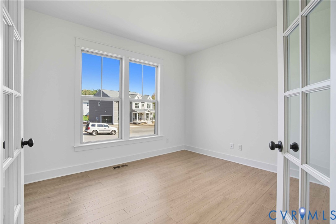 3731 Tuckmar Ridge Drive Moseley, VA 23120 - Photo 7 of 27 a view of wooden floor and window in a room