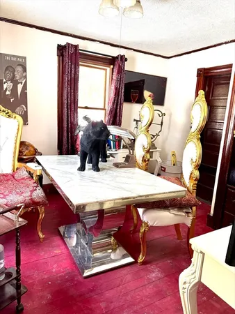 a dining room with furniture and window