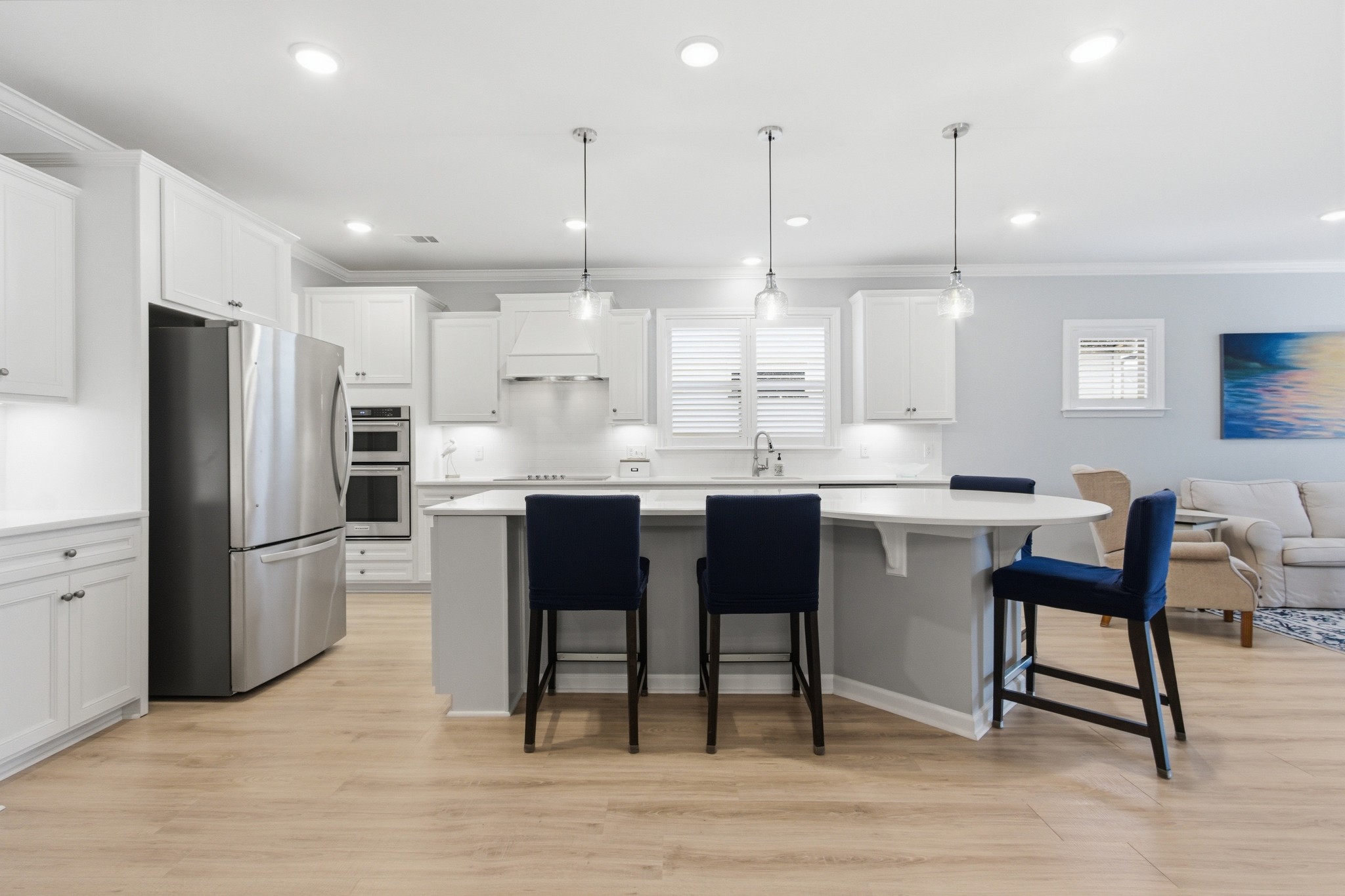 2321 Lawrence Ridge Spring Hill, TN 37174 - Photo 11 of 59 a kitchen with stainless steel appliances kitchen island granite countertop a table chairs and a sink
