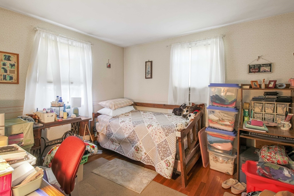 400 River Road Hudson, MA 01749 - Photo 8 of 24 a bedroom with a bed and a couch