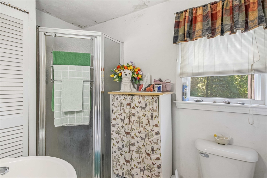 400 River Road Hudson, MA 01749 - Photo 10 of 24 a bathroom with a sink toilet and shower