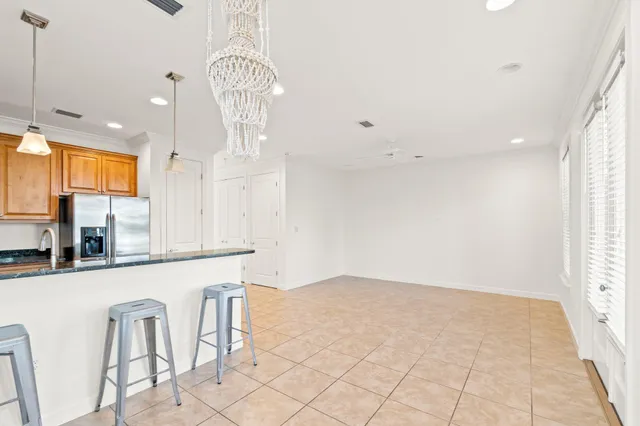 a view of a kitchen with granite countertop cabinets