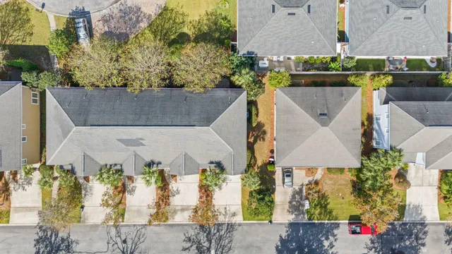 an aerial view of a house with a garden and plants