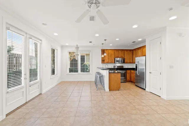 a view of a kitchen with a sink and a stove top oven