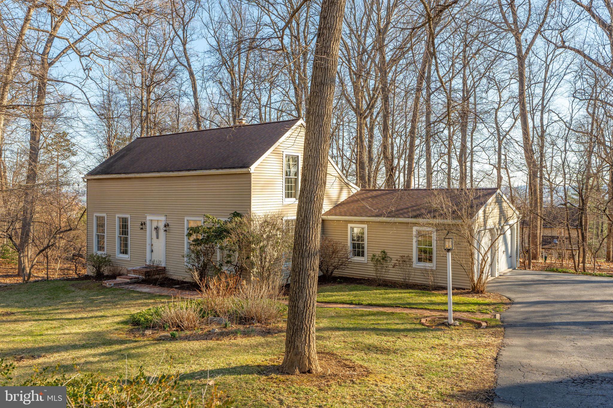 540 Grings Hill Road Reading, PA 19608 - Photo 1 of 43 a front view of a house with a yard table and chairs