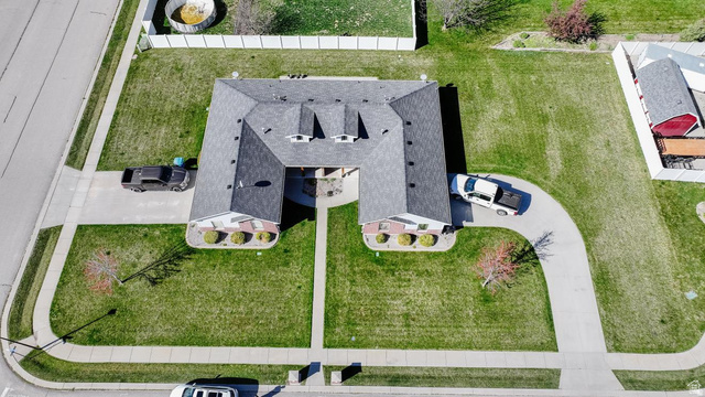 619 East 1st S Street, Unit S Preston, ID 83263 - Photo 13 of 16 U-shaped residence featuring a dark shingle roof and brick facade accents