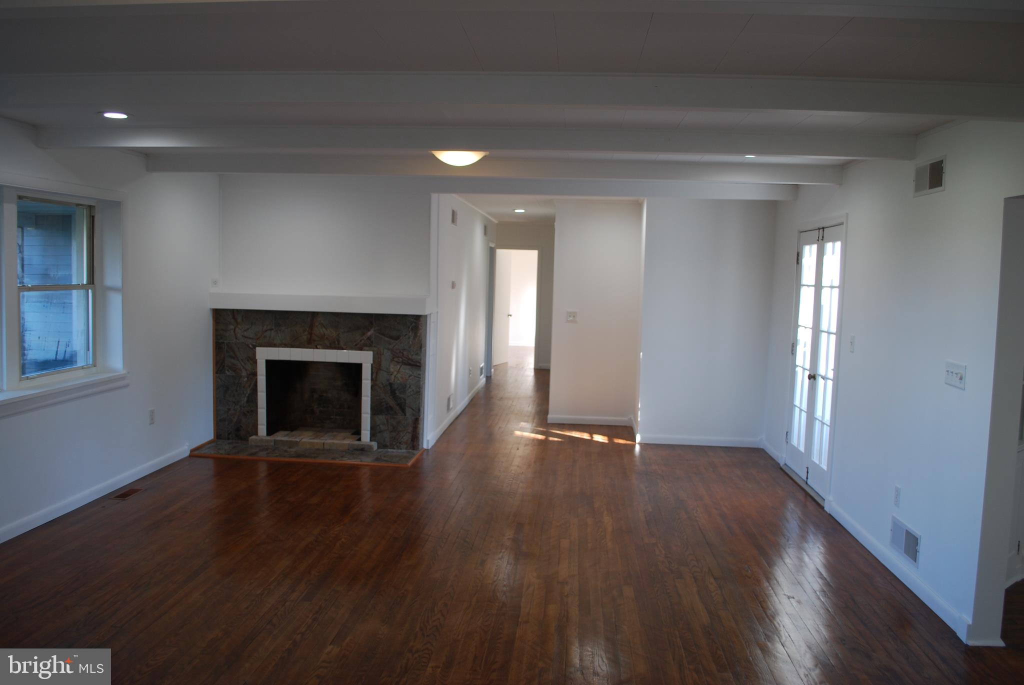 15719 Old Hanover Road Upperco, MD 21155 - Photo 12 of 34 Living room with fireplace and hardwood floors