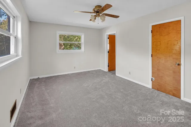 a view of a big room with windows