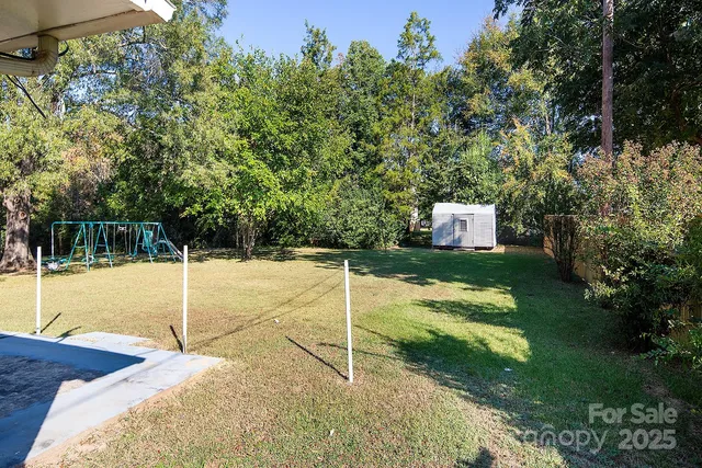 a house that has a tree in front of it