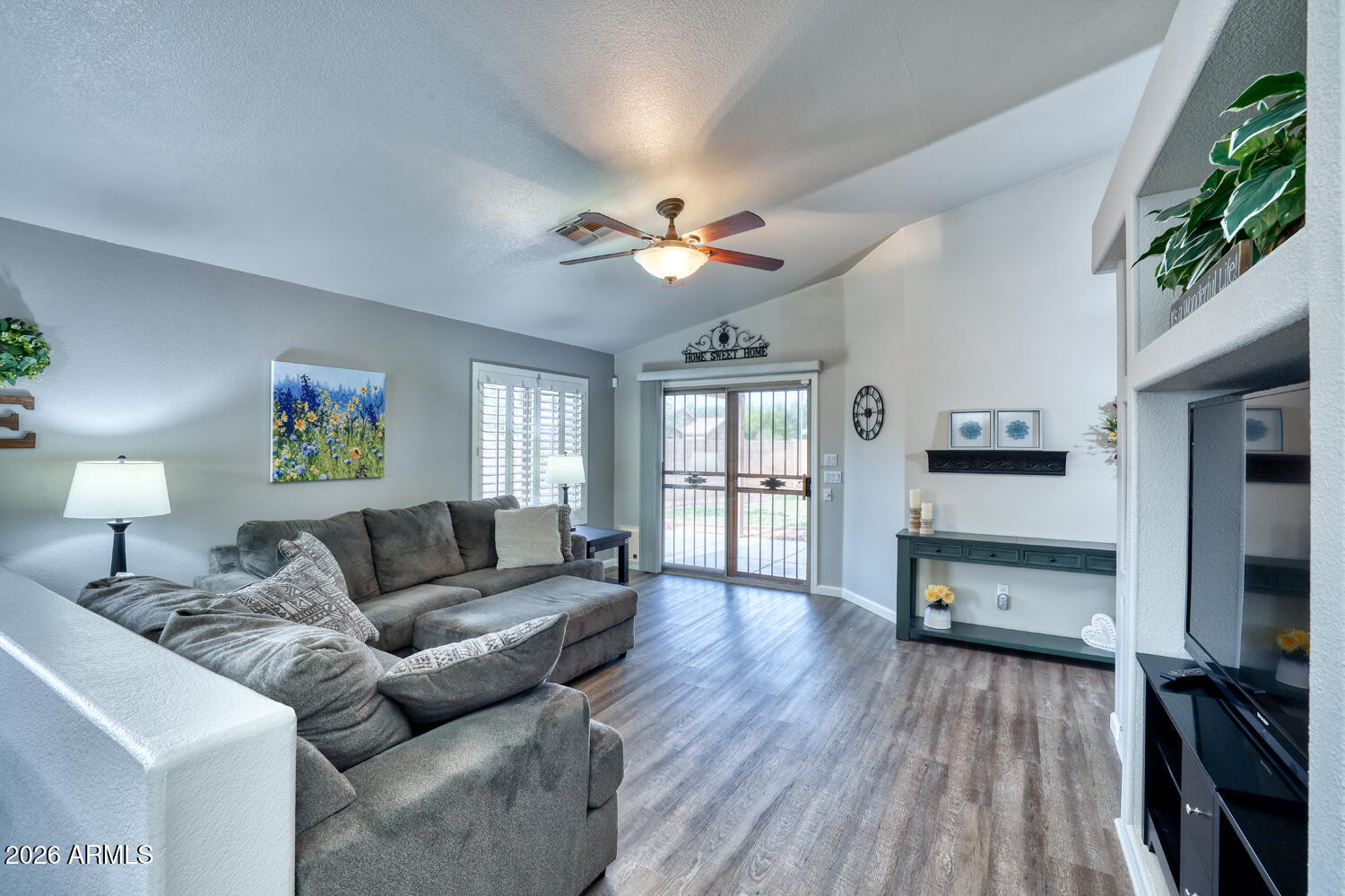 2206 East Ruby Lane Phoenix, AZ 85024 - Photo 11 of 29 a living room with furniture and a flat screen tv